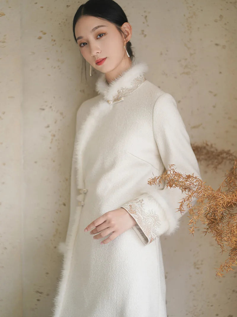 Long fleece winter qipao coat made of fine wool with full front opening and modern Chinese elegance