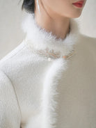 Long fleece winter qipao coat made of fine wool with full front opening and modern Chinese elegance