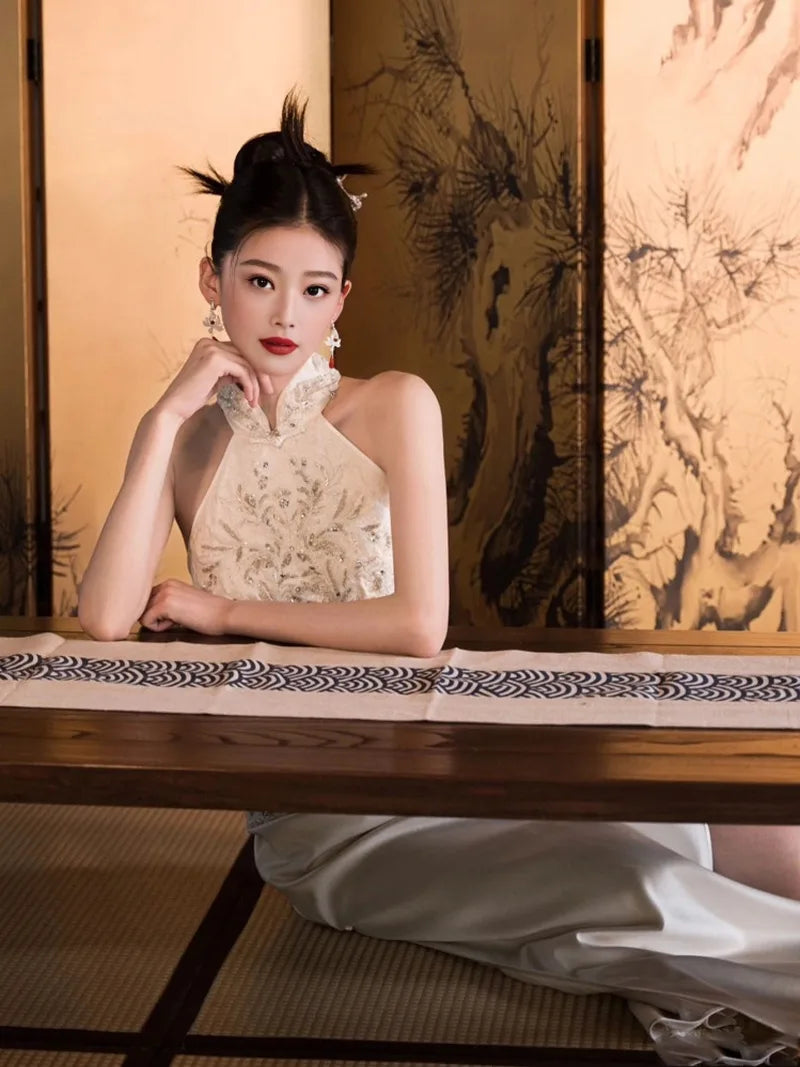 Formal dress for women featuring modern Chinese qipao halter neckline and luxury embroidery