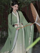 Elegant green hanfu dress with wide sleeves, flowing ancient Chinese style gown for women inspired by traditional beauty