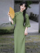Elegant green qipao dress with full front opening and floor-length vintage Chinese design