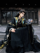 traditional hanfu male clothing featuring detailed patterns and elegant wide-sleeve cape