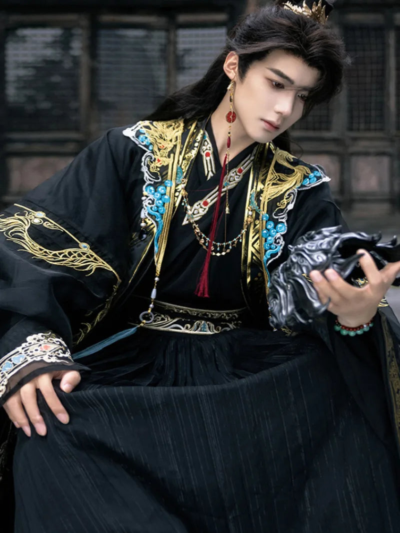 traditional hanfu male clothing featuring detailed patterns and elegant wide-sleeve cape