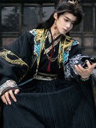 traditional hanfu male clothing featuring detailed patterns and elegant wide-sleeve cape