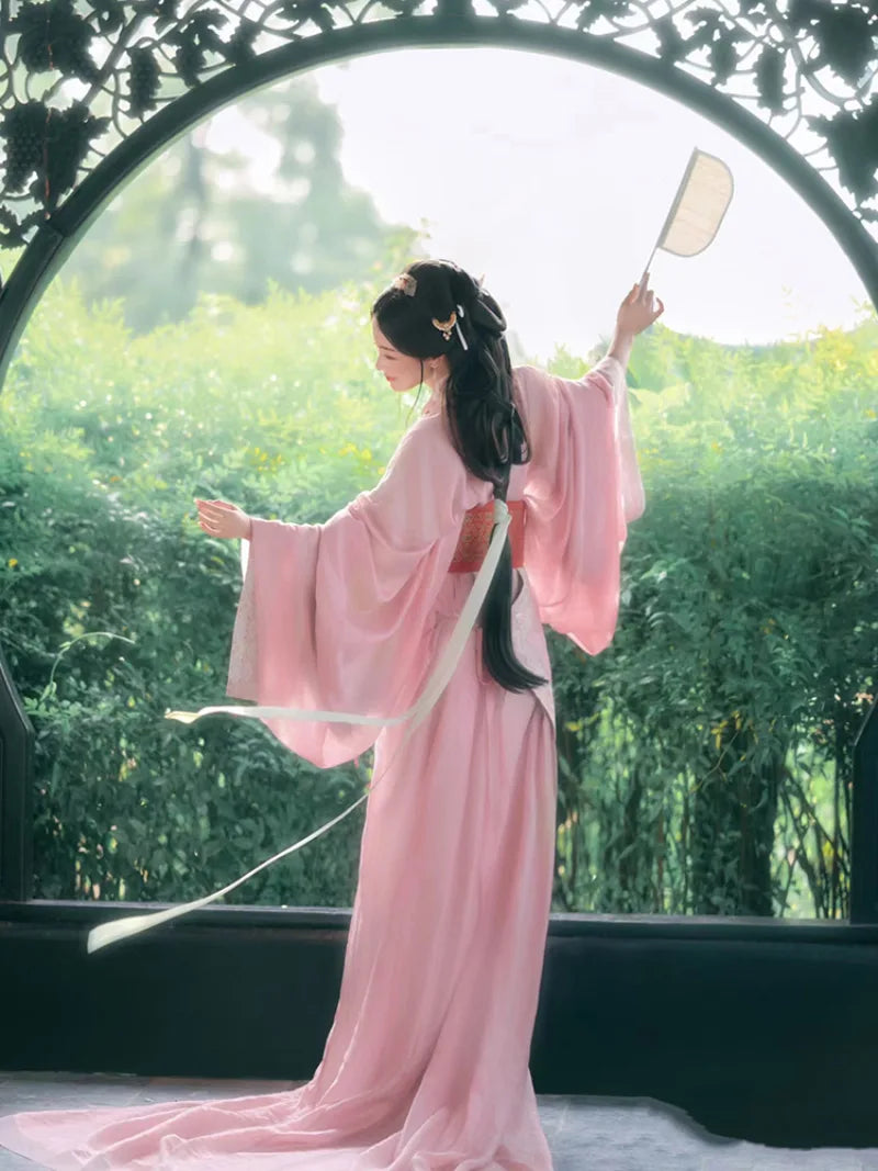 Elegant hanfu pink dress for women with wide sleeves, cross-collar, and flowing ancient Chinese summer gown design