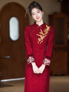 Festive Lunar New Year Qipao in red with embroidery and elegant silhouette.