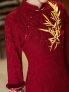 Festive Lunar New Year Qipao in red with embroidery and elegant silhouette.