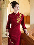 Festive Lunar New Year Qipao in red with embroidery and elegant silhouette.