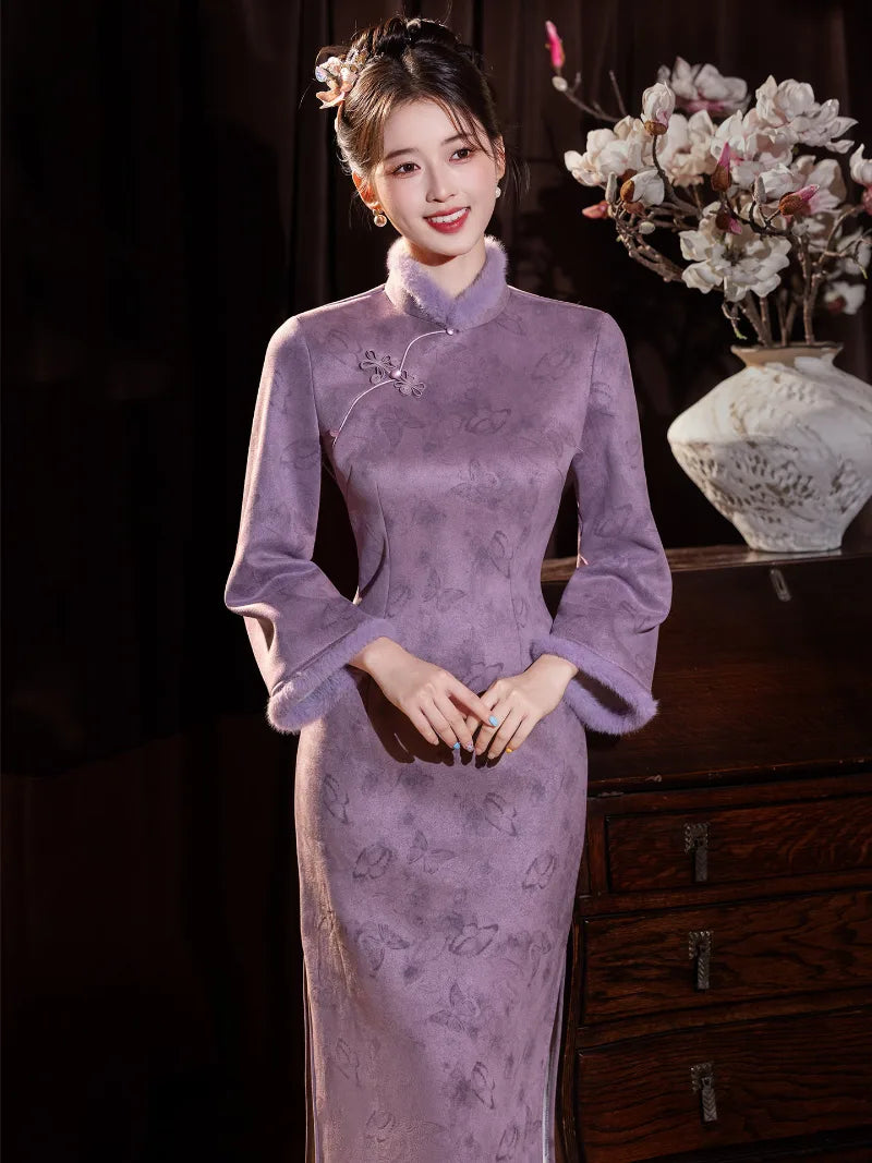 Warm purple winter qipao featuring soft suede fabric and a refined modern Chinese silhouette.