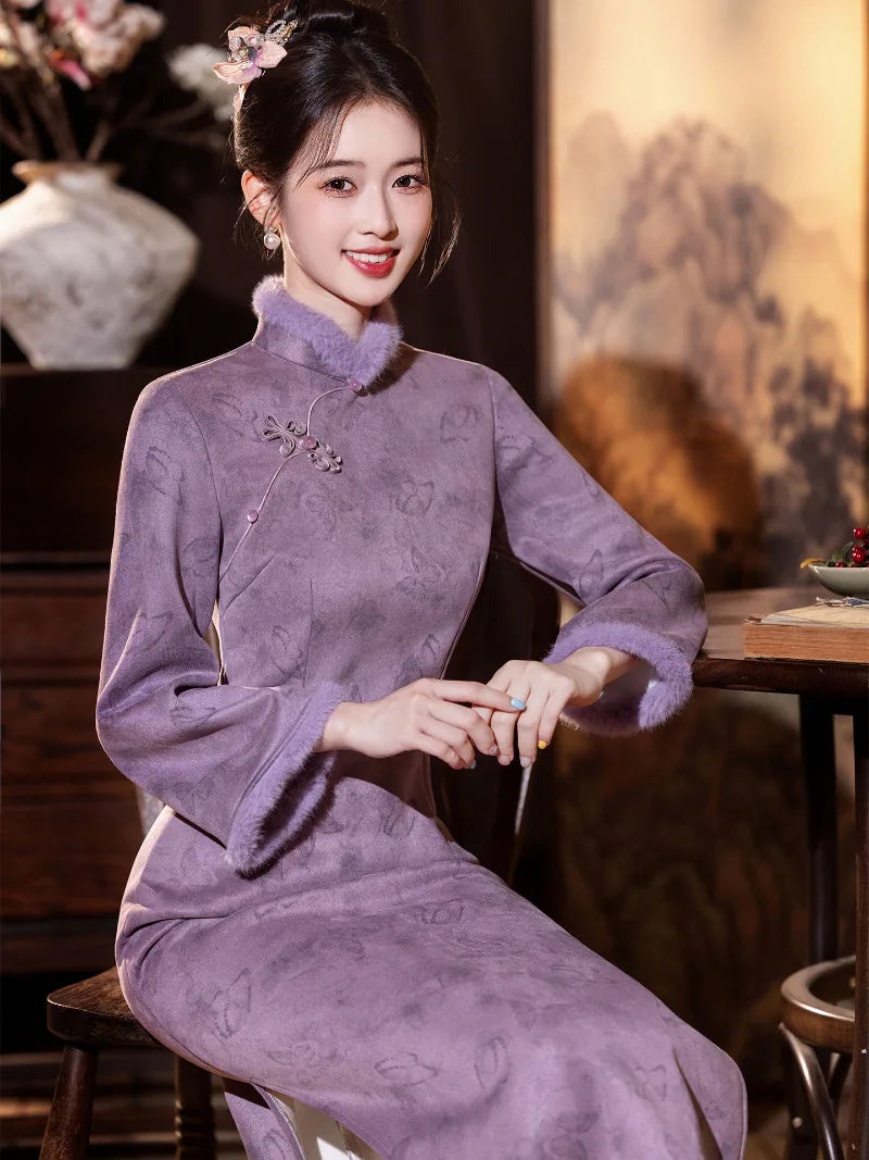 Warm purple winter qipao featuring soft suede fabric and a refined modern Chinese silhouette.