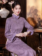 Warm purple winter qipao featuring soft suede fabric and a refined modern Chinese silhouette.