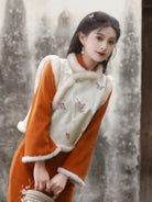 Qipao Chinese New Year embroidered winter dress for women, slim fit and elegant design.