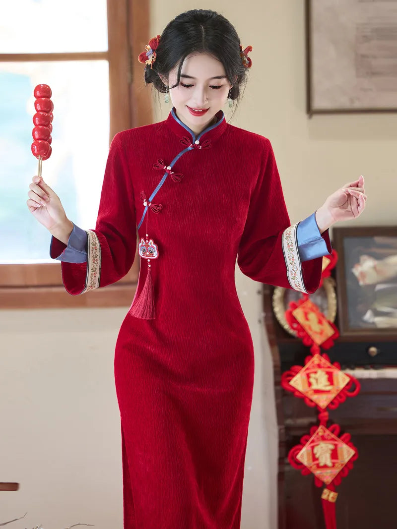 Elegant red qipao winter with long sleeves and intricate embroidery for bridal and festive occasions