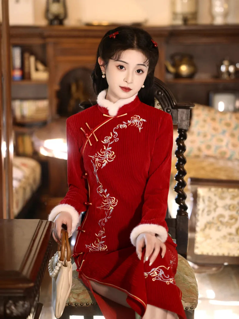 Elegant red cheongsam for new year with fitted silhouette and embroidered details for winter celebrations