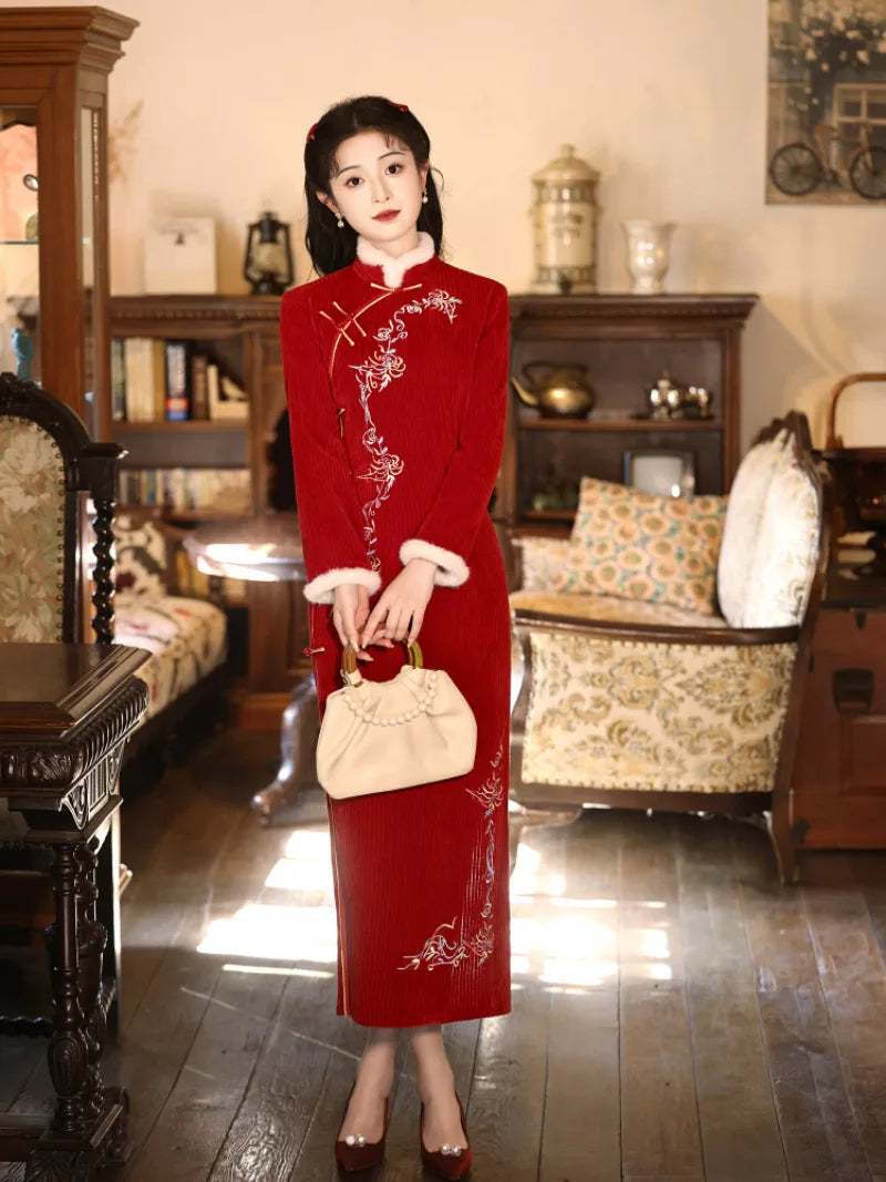 Elegant red cheongsam for new year with fitted silhouette and embroidered details for winter celebrations