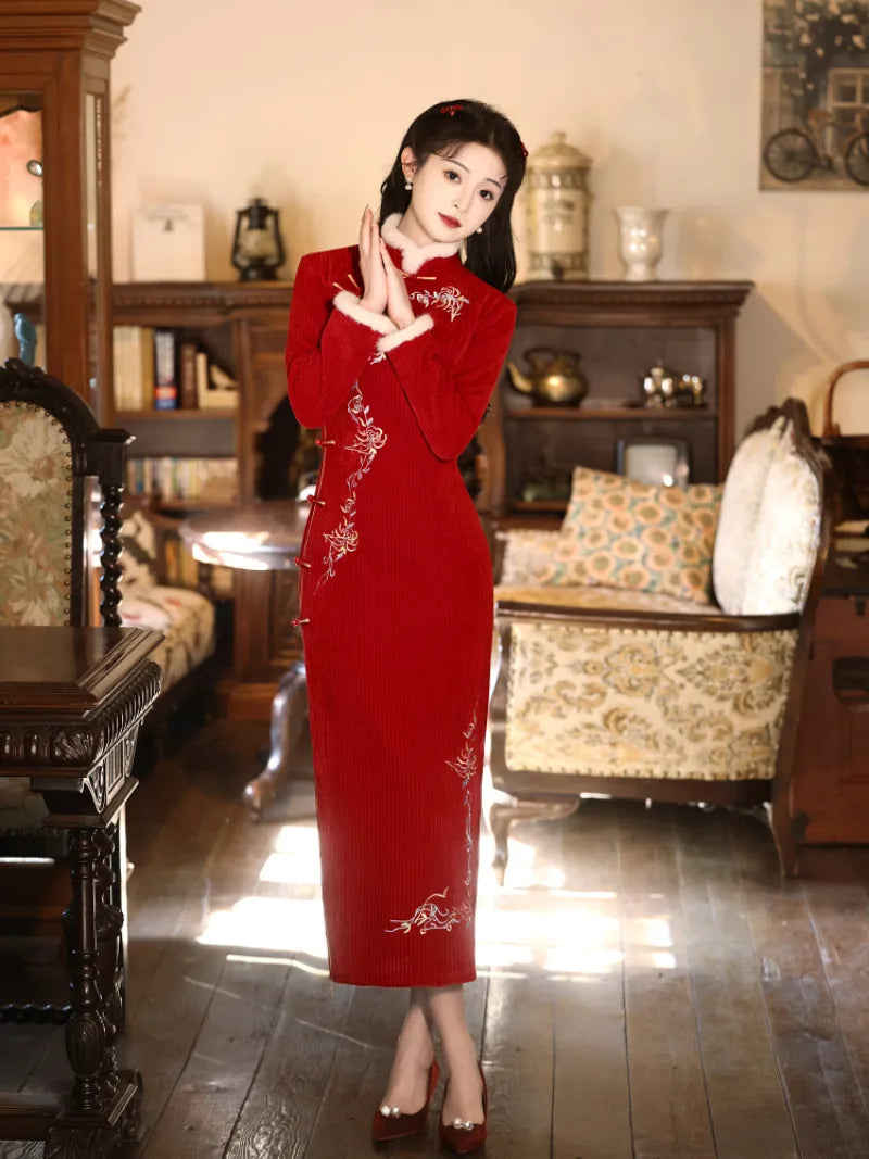 Elegant red cheongsam for new year with fitted silhouette and embroidered details for winter celebrations