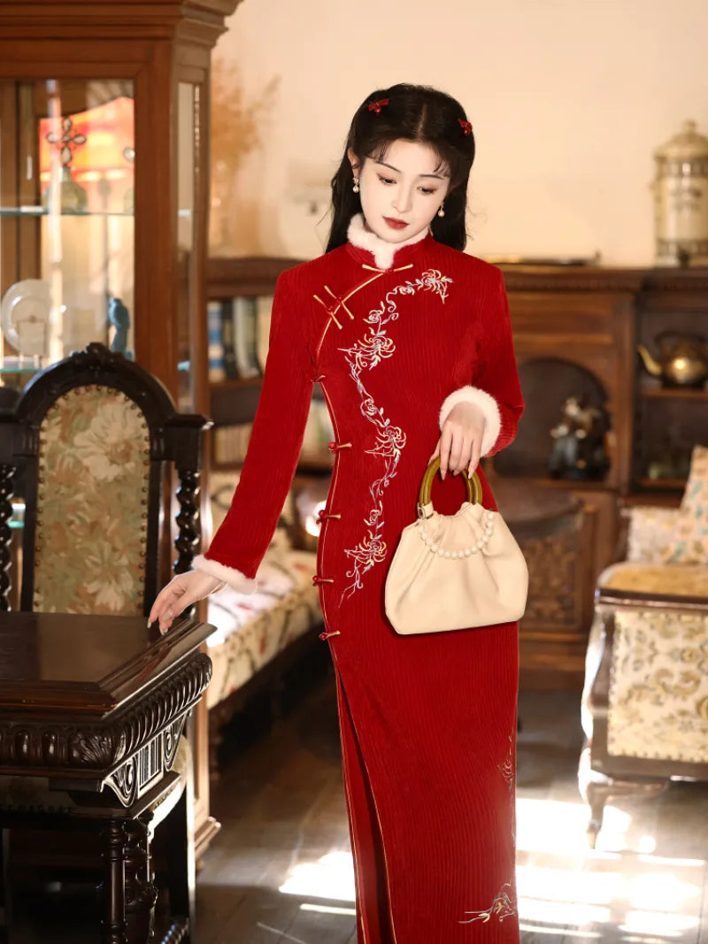 Elegant red cheongsam for new year with fitted silhouette and embroidered details for winter celebrations