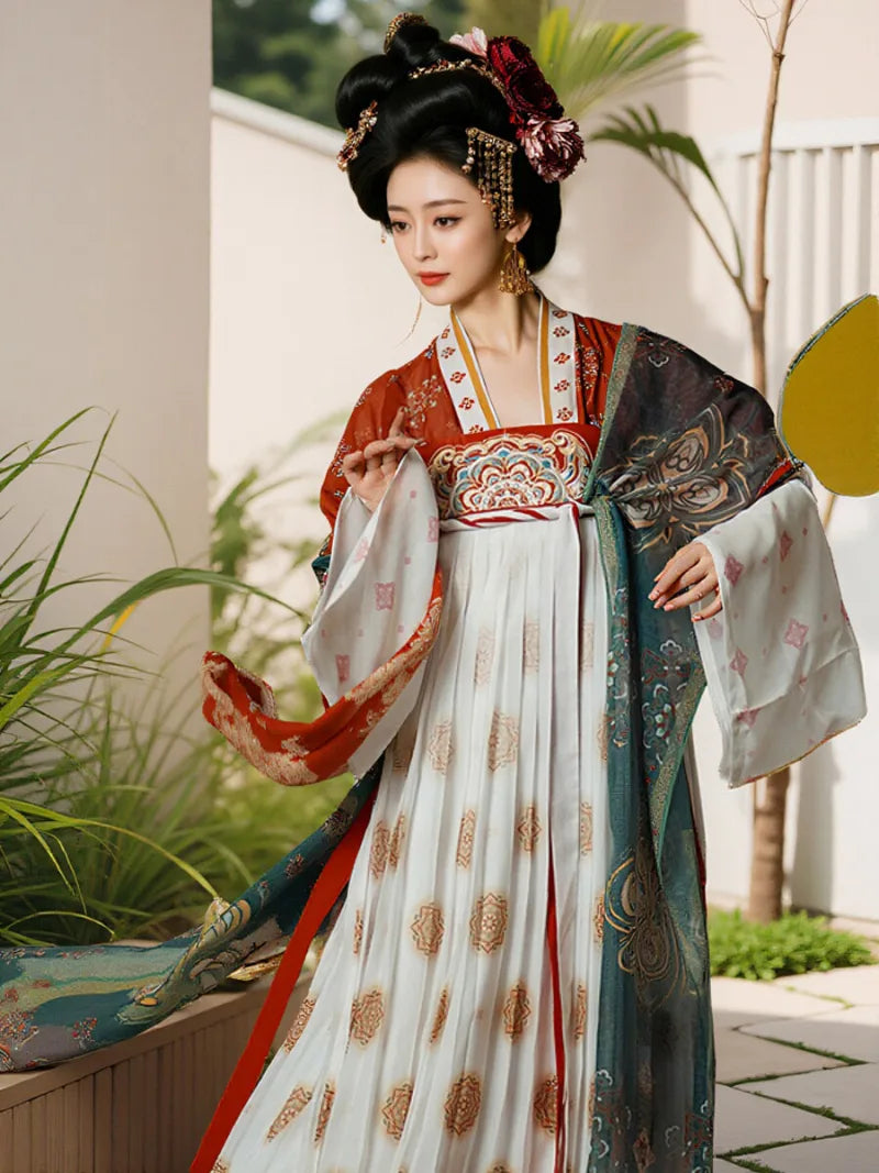 Restored tang dynasty hanfu dress featuring wide sleeves and colorful red gradient skirt patterns.