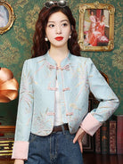 Elegant modern Tang jacket for women with embroidery, jacquard fabric, and traditional frog button details