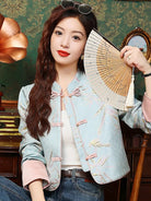 Elegant modern Tang jacket for women with embroidery, jacquard fabric, and traditional frog button details