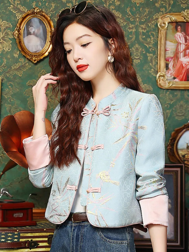 Elegant modern Tang jacket for women with embroidery, jacquard fabric, and traditional frog button details