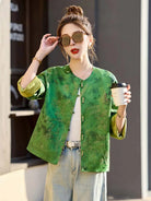 Elegant reversible Tang Suit for women featuring jacquard fabric, classic Chinese button design, and modern fashion silhouette.