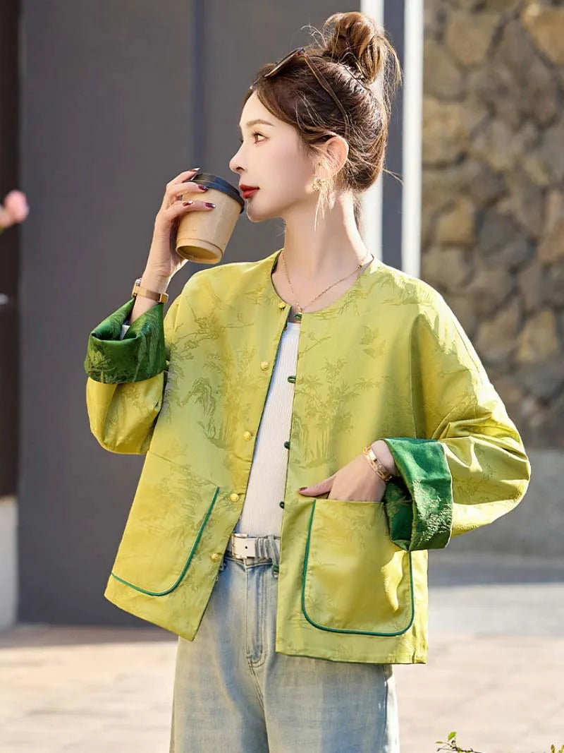 Elegant reversible Tang Suit for women featuring jacquard fabric, classic Chinese button design, and modern fashion silhouette.