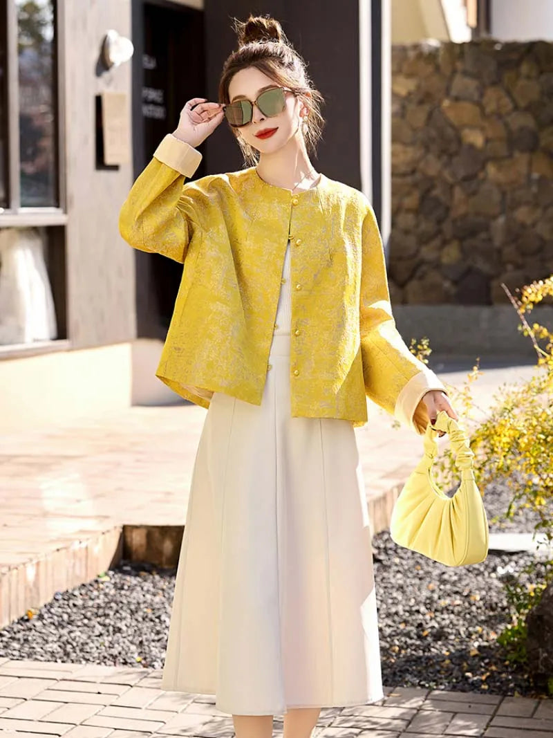 Yellow jacquard tang suit featuring round collar, delicate hem drape and comfortable wide-sleeve design for women