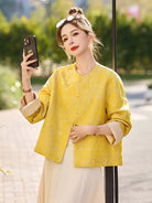 Yellow jacquard tang suit featuring round collar, delicate hem drape and comfortable wide-sleeve design for women