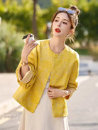 Yellow jacquard tang suit featuring round collar, delicate hem drape and comfortable wide-sleeve design for women