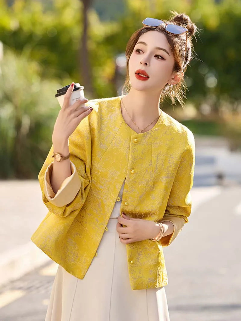 Yellow jacquard tang suit featuring round collar, delicate hem drape and comfortable wide-sleeve design for women