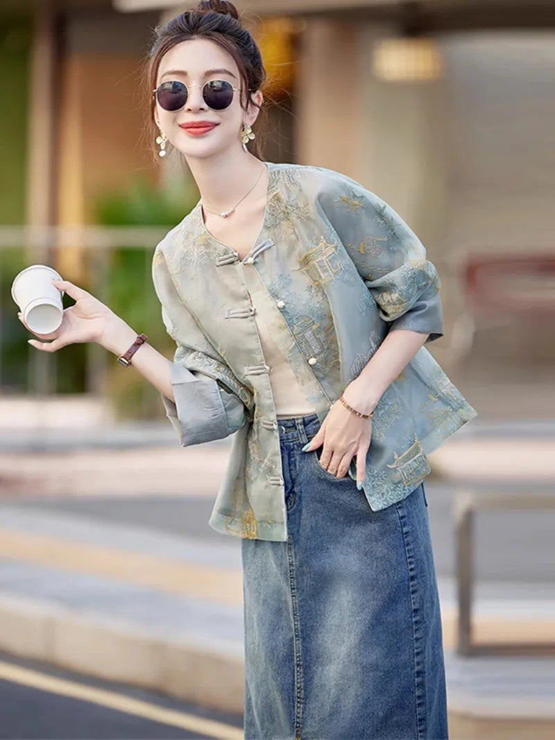 Elegant modern Tang jacket for women with embroidery, jacquard fabric, and traditional frog button details