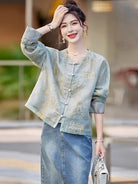 Elegant modern Tang jacket for women with embroidery, jacquard fabric, and traditional frog button details