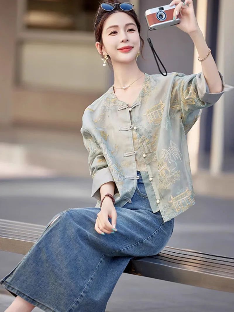 Elegant modern Tang jacket for women with embroidery, jacquard fabric, and traditional frog button details