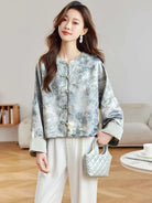 Elegant Tangzhuang jacket for women with jacquard fabric, classic pankou buttons, and modern Chinese vintage-inspired design
