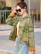 Modern Tangzhuang jacket for women featuring elegant prints, short design, and refined Chinese traditional craftsmanship.