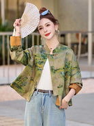 Modern Tangzhuang jacket for women featuring elegant prints, short design, and refined Chinese traditional craftsmanship.