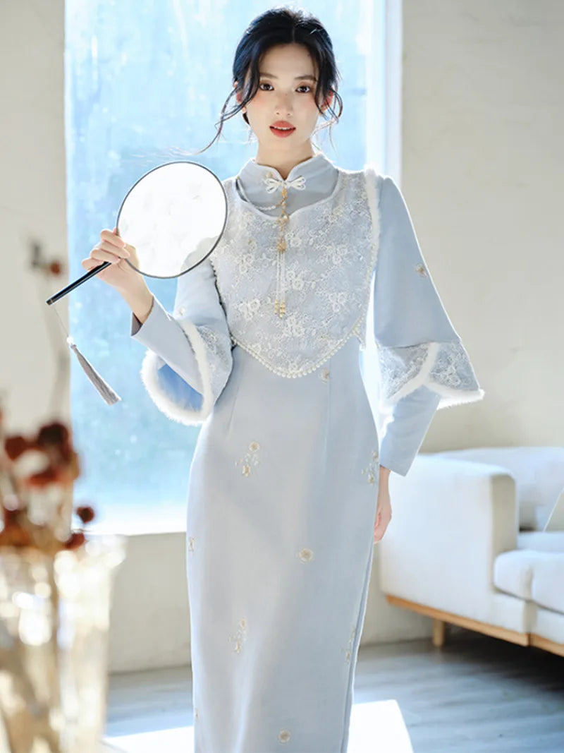 Thickened winter qipao in soft blue with fleece lining and matching vest for warm elegant seasonal wear