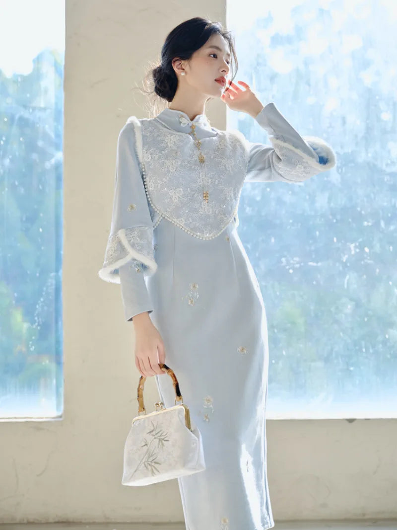Thickened winter qipao in soft blue with fleece lining and matching vest for warm elegant seasonal wear