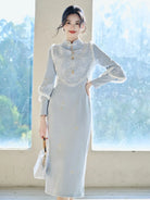 Thickened winter qipao in soft blue with fleece lining and matching vest for warm elegant seasonal wear